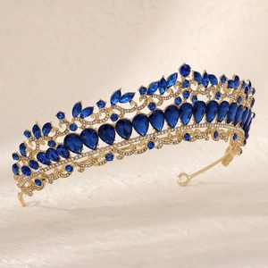 Royal style golden bridal crown with marquise blue gemstones and clear sparkling crystals