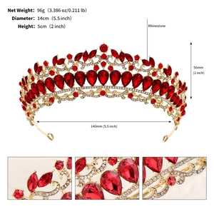Detail view of bridal crown with red teardrop rhinestones and golden filigree design