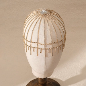 Detailed view of the sparkling crystal fringe and golden mesh on the bridal headpiece