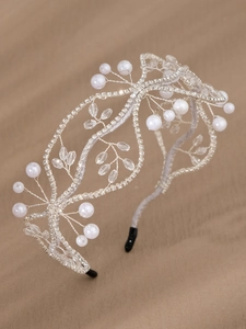 Detailed macro view of handmade silver bridal headband with white pearls and clear crystals