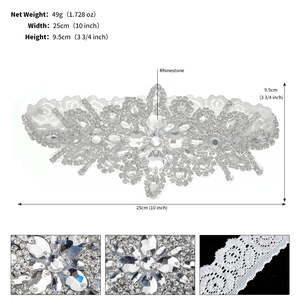 Detailed view of white lace bridal garter with rhinestones and precise size specifications