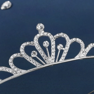 Close-up of sparkling silver crown headband with crystal rhinestones for girls