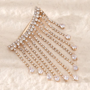 Elegant gold bow hair clip with rhinestone tassels and teardrop crystal pendants