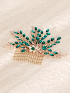 Detail of leaf hair comb with emerald marquise rhinestones and white pearls