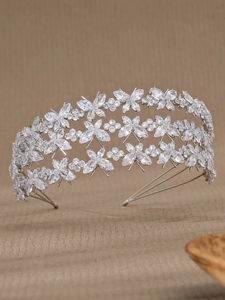 Close-up of luxury multi-layer silver headband with marquise-cut zircon butterfly patterns