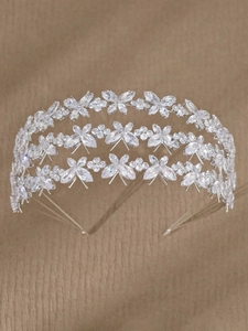 Detailed close-up of a three-layer silver headband with sparkling butterfly zircon crystals