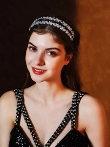 Detail of silver double-layer headband with sparkling leaf-shaped zircon crystals
