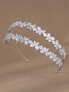 Detailed macro view of silver double-layered headband with zircon floral and leaf patterns