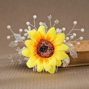 Elegant sunflower hair comb with white pearls and silver leaves for bridal styling