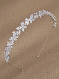 Detailed side view of silver bridal headband with marquise and round zircon leaves