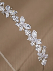 Detailed macro view of multilayer zircon stones on a silver bridal headband