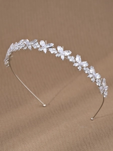 Detail view of silver headband featuring butterfly shapes and marquise-cut zircon stones