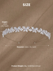 Detailed macro view of silver bridal headband with zircon butterflies on a textured fabric