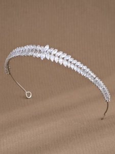 Macro view of multi-layer marquise zircon headband with intricate silver leaf pattern