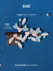 Detail view of floral hair comb with size specs: 12cm length, 8.5cm width, and 22g weight