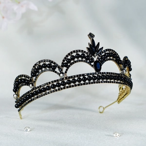 Detailed view of the black rhinestone and gold alloy vintage bridal crown and tiara