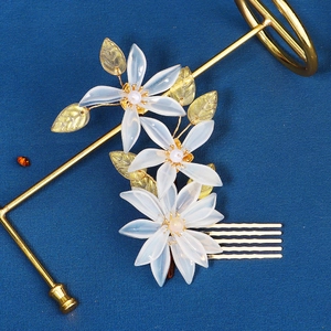 Elegant Chinese style bridal hair comb with translucent white flowers and gold leaves