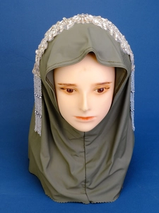 Detail of olive green hijab with crystal rhinestone headband and dangling bead tassels