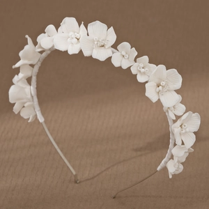 Elegant white ceramic flower bridal headband with handcrafted bead details and gold wire