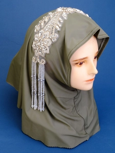 Detail of dark olive hijab with silver floral lace crystal applique and blue beaded fringe