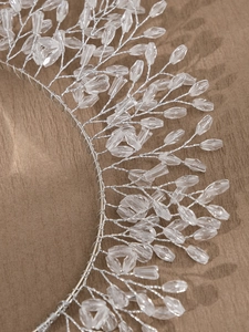 Macro detail of handmade silver wire bridal headband with clear crystal beads