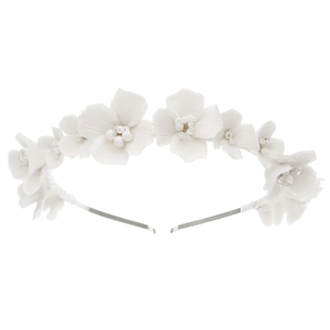 Elegant bridal headband featuring white ceramic flowers with pearls and silver metallic band