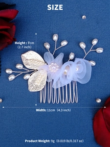 Detailed view of 11cm x 7cm bridal hair comb with blue flowers, pearls, and gold leaves