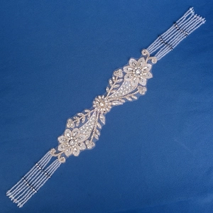 Middle Eastern style crystal hair chain with rhinestone tassels and white floral beadwork