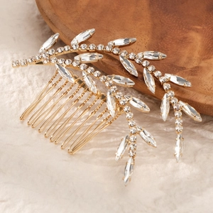 Elegant gold leaf bridal hair comb with shimmering crystals and rhinestones for weddings