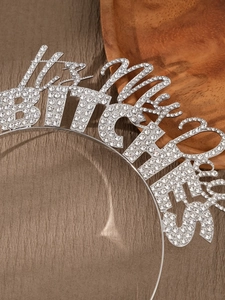 Detailed view of silver rhinestone headband featuring IT'S MY BIRTHDAY text for parties