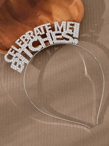 Close-up of silver rhinestone headband featuring Celebrate Me Bitches lettering for party