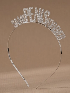 Close-up of sparkling rhinestone lettering on silver bachelorette party headband