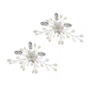 Detailed view of handmade bridal shoe clips featuring white pearls and crystals