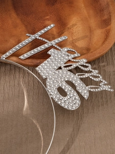 Macro shot of silver rhinestone Happy 16 birthday headband with sparkling crystals