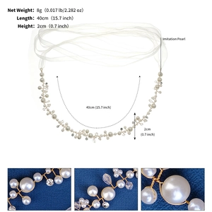 Detail view of handmade pearl belt with crystals and white tulle ribbon ties