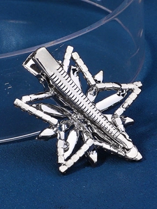 Detailed back view of a silver-toned metal hair clip with secure alligator grip
