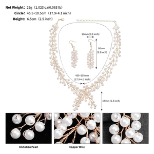 Detailed view of handmade multi-layer imitation pearl necklace and earrings bridal jewelry set