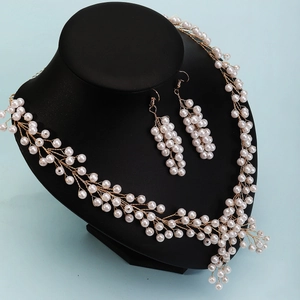 Luxury multilayer pearl and crystal bridal necklace set with elegant drop earrings
