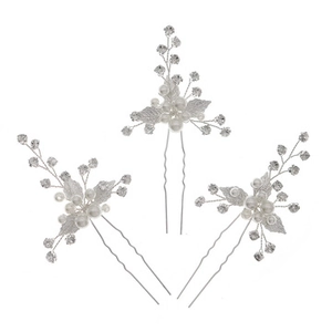 Macro detail of three silver hair pins with pearls and crystal leaf floral design