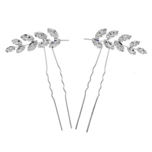 Detail view of silver leaf-shaped bridal hair pins with marquise crystals in a U-shape