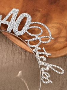 Detail view of a 40th birthday headband featuring silver metal and sparkling rhinestones