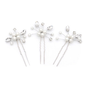 Detailed view of silver hair pin set with white pearls and sparkling marquise rhinestones