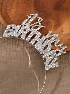 Close-up of silver Birthday Girl headband with sparkling rhinestones for party styling