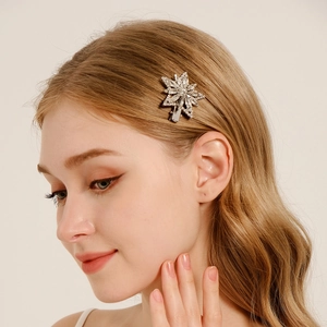 Sparkling snowflake rhinestone hair clip on model hair with silver alloy base