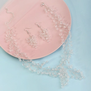 Luxurious bridal jewelry set featuring crystal leaf hair vine and matching earrings