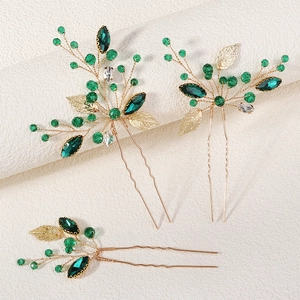 Handmade bridal hair pin set with green crystals and golden leaves for vintage weddings
