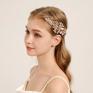 Handmade bridal hair comb with gold metal flowers leaves and pearls for wedding hairstyles