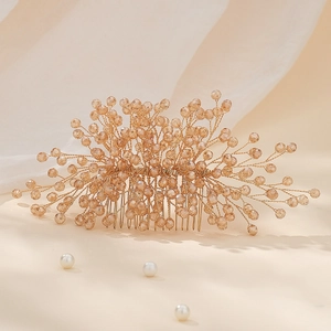 Luxurious champagne crystal bridal hair comb featuring handmade beadwork and golden wire design