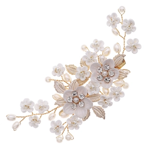 Handmade bridal flower hair clip with pearls and rhinestones on a gold wire frame