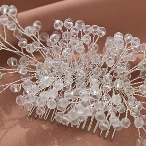 Exquisite bridal hair comb with handmade crystals and silver wires on soft fabric